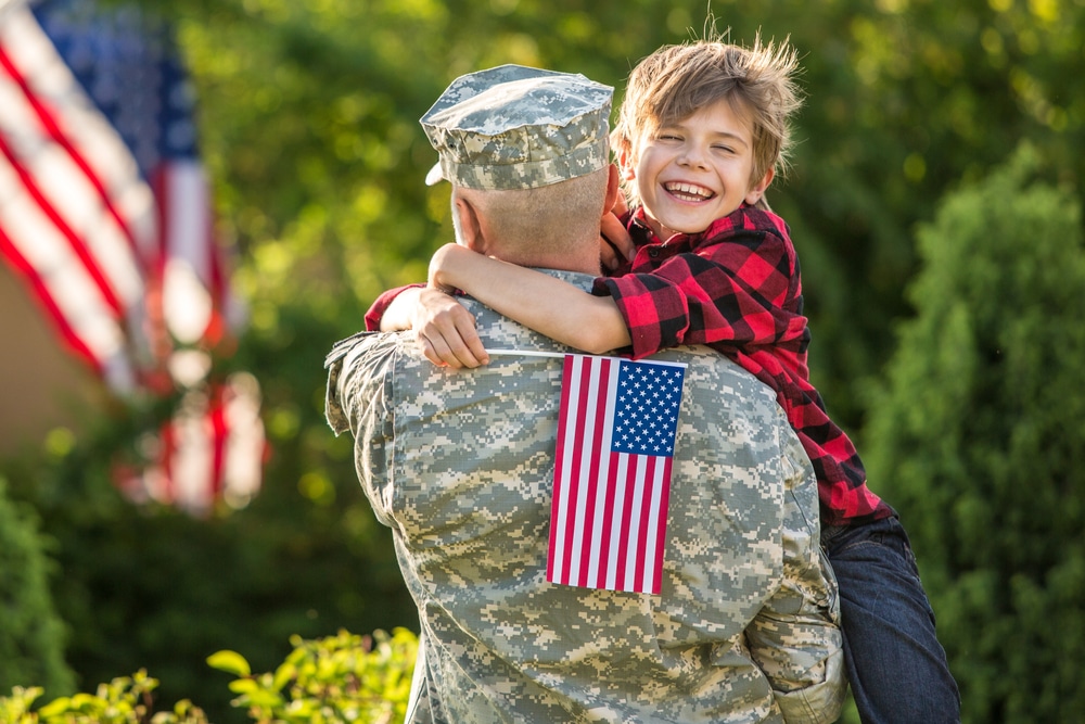 American,Soldier,Reunited,With,Son,On,A,Sunny,Day,With